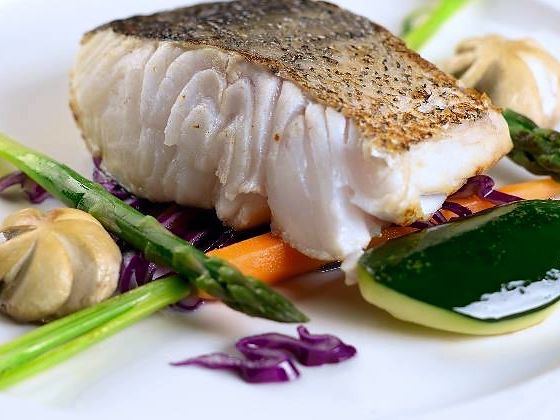 Sea bass fillet with baby vegetables and asparagus